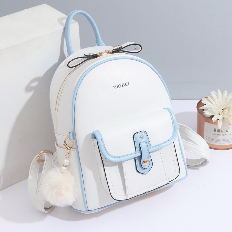 Women Bags White - กระเป๋าเป้สะพายหลังเนื้อสีทึบมีสไตล์สำหรับผู้หญิงเป้น้ำหนักเบาที่เข้าคู่กันของตกแต่งจี้ pompon ขนาดเล็กแบบเรียบง่าย